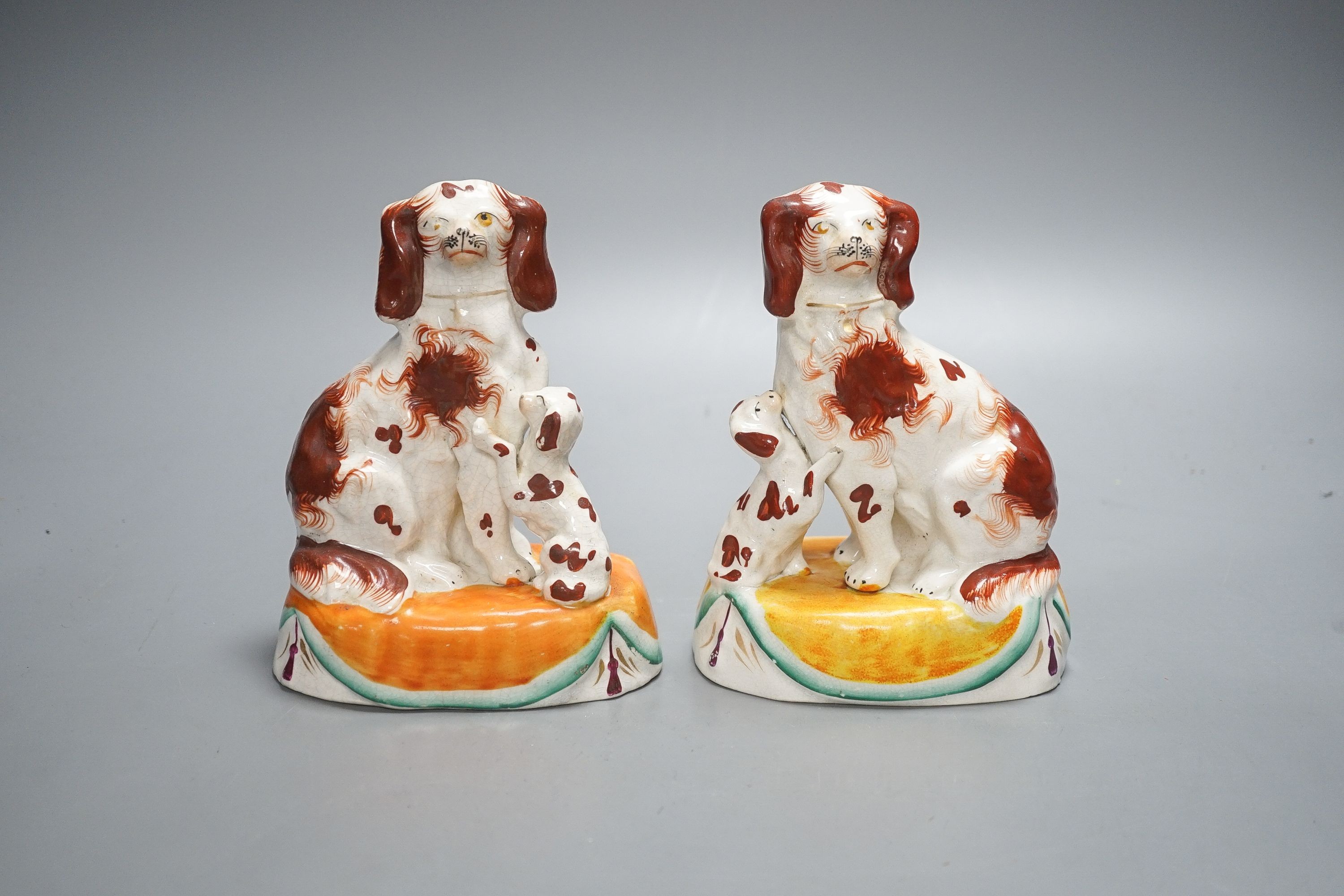 A pair of Staffordshire spaniel and puppy groups, 15cm high